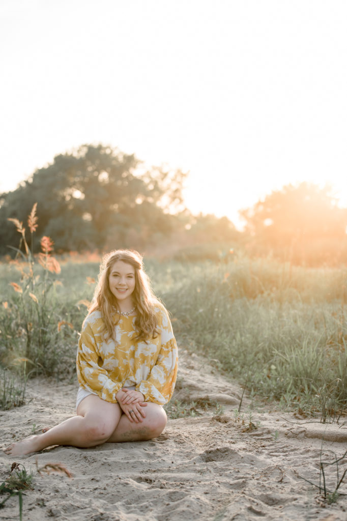 senior photography at sunset in river
