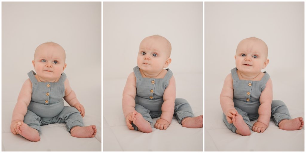 6 month photography of baby boy in blue overalls